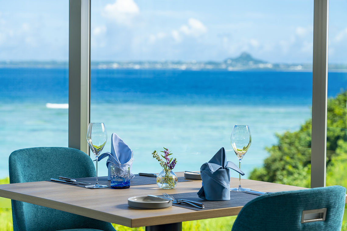 a set dining table overlooking the sea